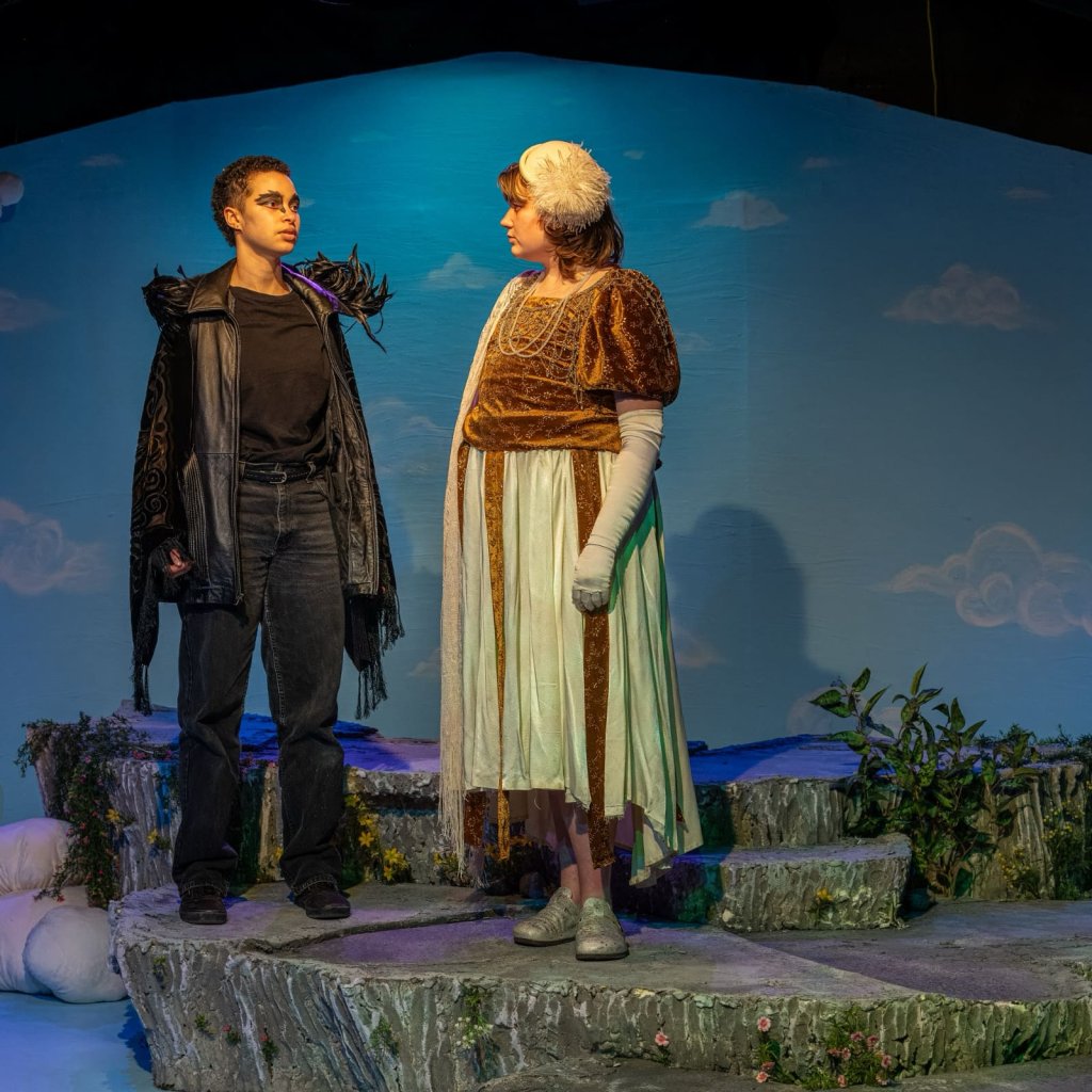 Two people dressed as a raven and nightingale
