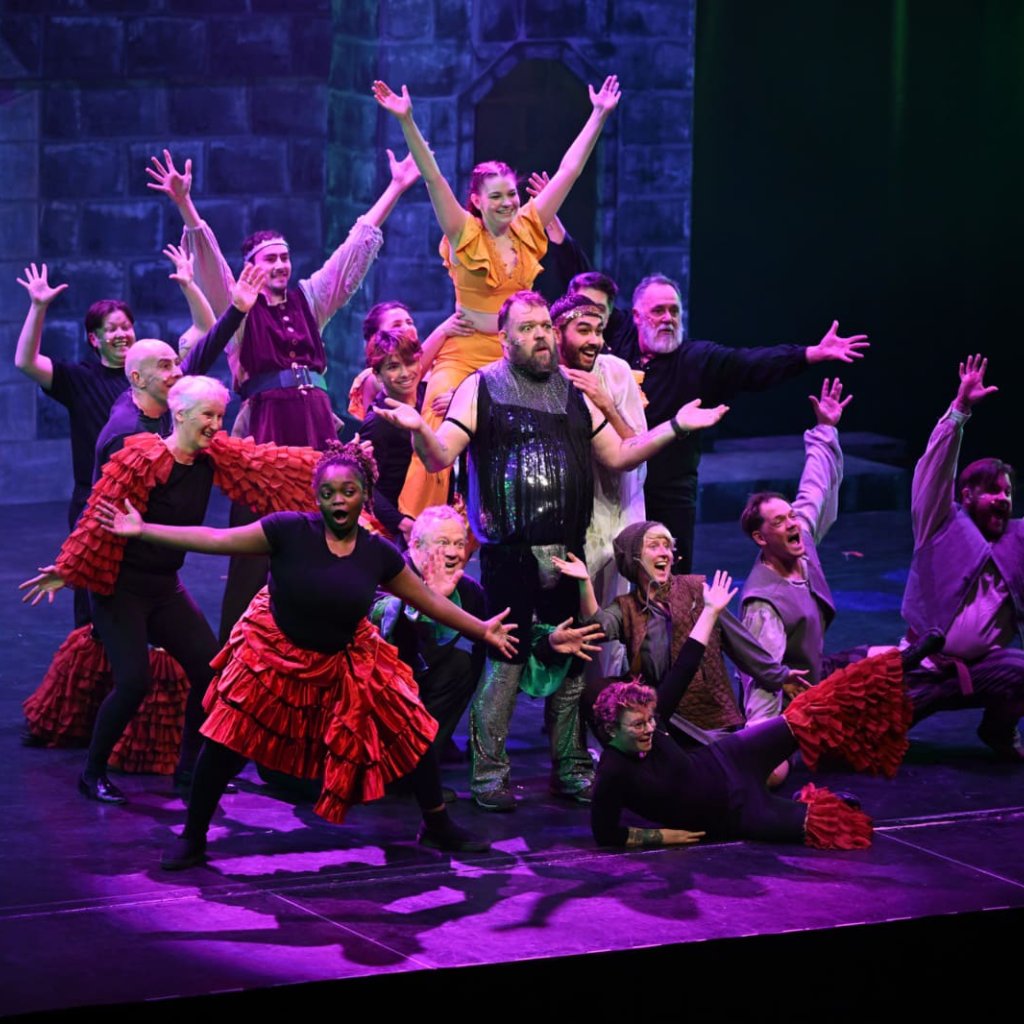 Spamalot archive photo. The company poses around a surprised looking Sir Lancelot.